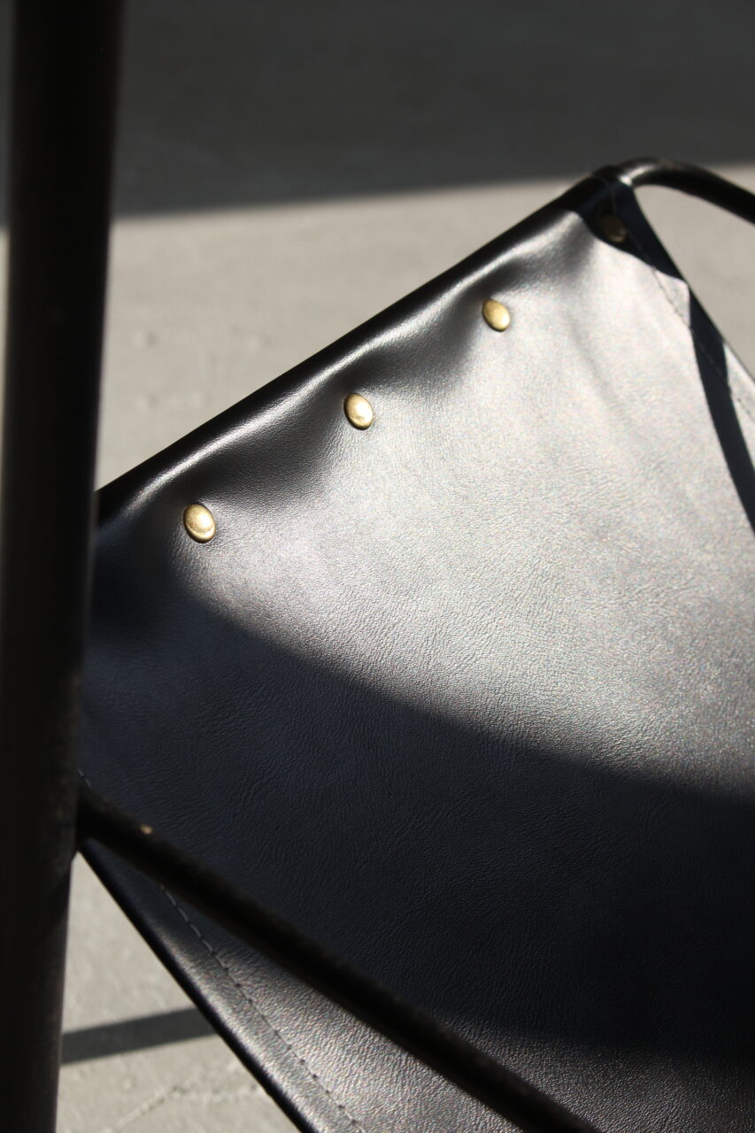 JACQUES ADNET / SIDE TABLE WITH MAGAZINE RACK